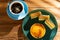 cheese cake with matcha cakes and cup of coffee at background in a sunny morning horizontal composition