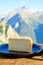 Cheese collection, French tomme de savoie or tome des bauges cheese served outdoor with Alpine mountains peaks on background