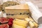 Cheese collection, marble board with French cheeses brie, tomme, matured goat cheese, morbier  served with fresh raspberries and