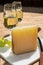 Cheese collection, piece of spanisch hard manchego cheese made in La Mancha region from sheep milk and glasses of sherry wine