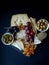 Cheese,cracker,grape,nuts on a black background