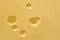 Cheese cut hole pattern, large detailed horizontal background closeup
