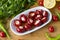 Cheese filled cherry peppers on wooden background.