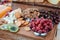 Cheese and fruits on a beautifully vintage decorated table