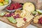 Cheese and fruits on a beautifully vintage decorated table