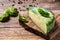 Cheese with hard crust, pesto sauce, spirulina. Bulgarian green cheese. banner menu recipe place for text