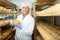 Cheese maker controlling maturing process of cheese wheels