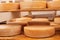 Cheese maturing on shelf - traditional aging method in small dairy