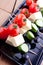 Cheese and olive canapes with tomato and cucumber