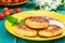 Cheese pancake with jam and fresh cherries. Wooden turquoise background. Top view. Close-up