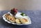 cheese pancakes or sirniki, syrniki traditional breakfast in Russia and Ukraine, delicious dessert with sour cream and fresh fruit