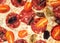 Cheese pizza with salami, olives and cherry tomato texture, top view. Macro homemade tasty pepperoni
