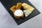 Cheese plate. Assortment of cheese on a stone plate. close up. set