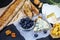 Cheese plate - brie, camembert and parmesan tasting with berries, nuts, snack. Food banner for text or design. Top flat view photo