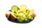 Cheese plate, different types of cheese and grapes on a blue plate isolated on a white background
