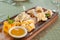 Cheese plate. Different types of cheese with honey on a wooden board.