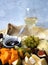 Cheese plate with glass of white wine and grape and figs