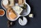 Cheese plate served with various crackers, jam, figs, caper berries and pickled onions. Top view photo with space for text