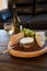 Cheese plate and wine including chardonnay, gourmet crackers