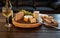 Cheese plate and wine including chardonnay, gourmet crackers