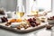 Cheese plate and wine, White kitchen. Bright and airy. Food photography