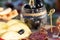 Cheese plates served with grapes, jam, figs, crackers and nuts on a wooden background