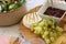 Cheese platter with cherry preserves, grapes and brie