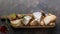 Cheese platter with different cheeses, wine and fruits on stone background. Top view