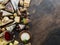 Cheese platter with organic cheeses, fruits, nuts and wine on stone background. Top view. Tasty cheese starter