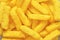 Cheese puffs, Colorful Cheetos. Close up shot of Cheese puffs, background texture