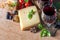 Cheese with red wine, walnuts, and grapes. food background