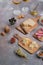 Cheese, salumi, olives, nut and grapes on wooden board, copy space