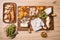 Cheese selection on wooden rustic board. Cheese platter with different cheeses, grapes, nuts, honey on wooden table