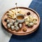Cheese serving set on wooden Board