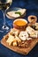 Cheese set with honey and nuts. Assortment of cheeses on a wooden board. Cheese appetizer set