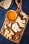 Cheese set with honey and nuts. Assortment of cheeses on a wooden board. Cheese appetizer set