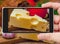 Cheese on smartphone screen. Vegetarian still life.
