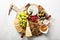 Cheese and snacks plate on white background