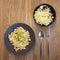 Cheese spaetzle with onion and chives served with coleslaw bowl