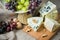 Cheese still life with red grapes