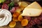 Cheese on table with snacks - party buffet with various savory foods