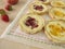 Cheese tartlet with strawberry jam and peach jam