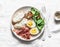 Cheese toast, boiled egg, prosciutto, spinach, tomatoes - delicious healthy breakfast, snack, brunch on light background, top view