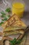 Cheese toasts for breakfast and orange juice in glass. Sandwich