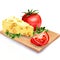 Cheese with tomatoes on wooden board