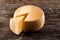 Cheese wheel on wooden table