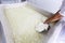 Cheese worker hands creamery dairy mixing