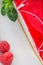 Cheeseake with raspberry cream and fresh fruit on white plate, gluten free cake, product photography for patisserie