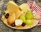 Cheeseboard with pears and wine on a table