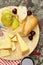 Cheeseboard with pears and wine on a table